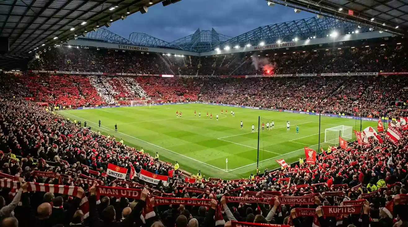 Ambiente de derbi en un estadio de la Premier League con aficiones rivales en las gradas